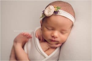 Newborn Photography Bentonville AR | Newborn Baby girl photography session in NWA with soft colors and floral accents | Erica Kirby Photography