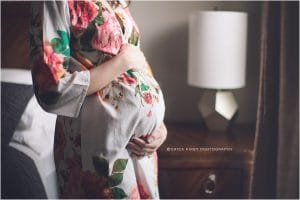 Maternity Photographer NWA | Intimate in-home maternity session in floral robe denim shirt window light | Erica Kirby Photography
