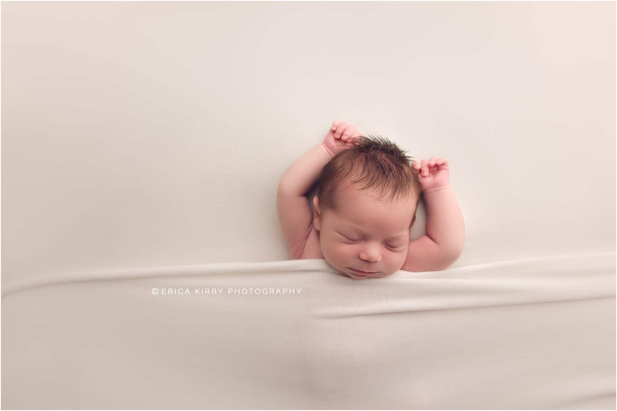Newborn Photography NWA | Baby boy newborn photography session in Bentonville Arkansas | baby on cream background unposed