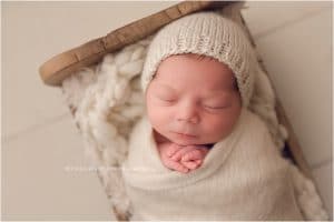Baby boy newborn photography session in Bentonville Arkansas | neutral newborn poses the original photo blocks props little bed