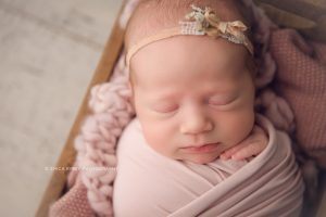 Newborn Baby Photographers NWA - baby girl swaddled newborn photo session soft natural styled studio session - erica kirby photography